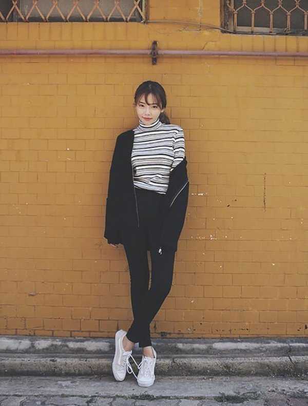 cách tạo dáng chụp ảnh đẹp - bắt chéo chân đứng tựa tường